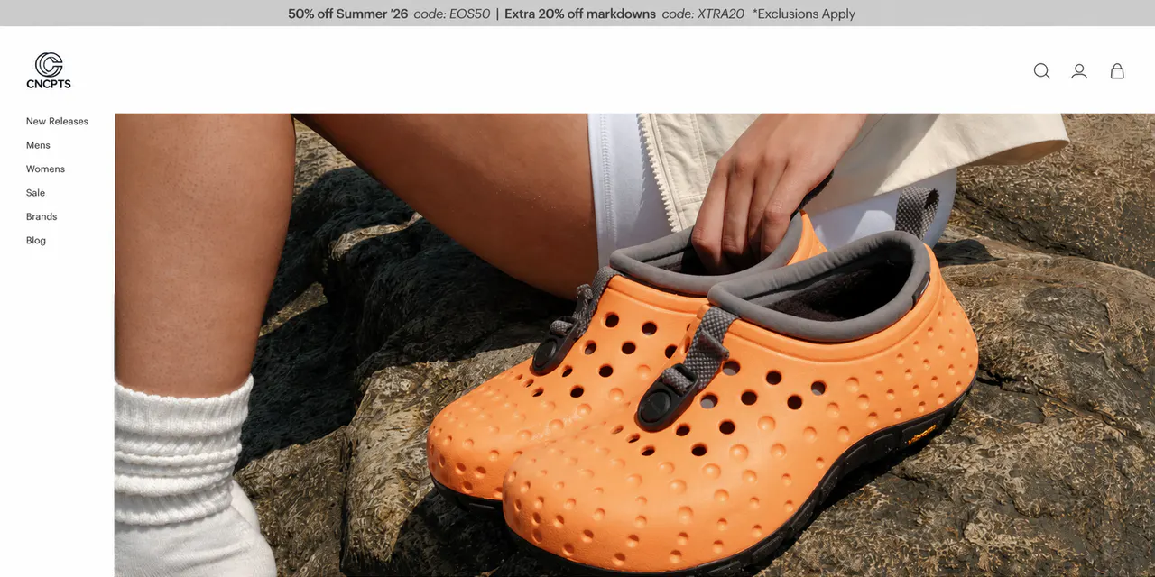 CNCPTS homepage showing its desktop navigation and a large footwear campaign banner